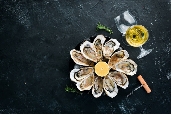 A Dozen Oysters with Champagne and Chablis